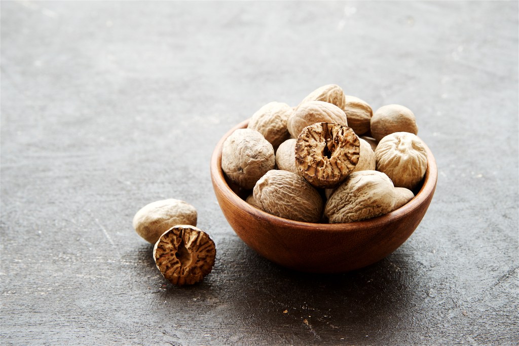 whole nutmeg in a bowl