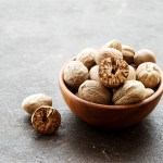 whole nutmeg in a bowl