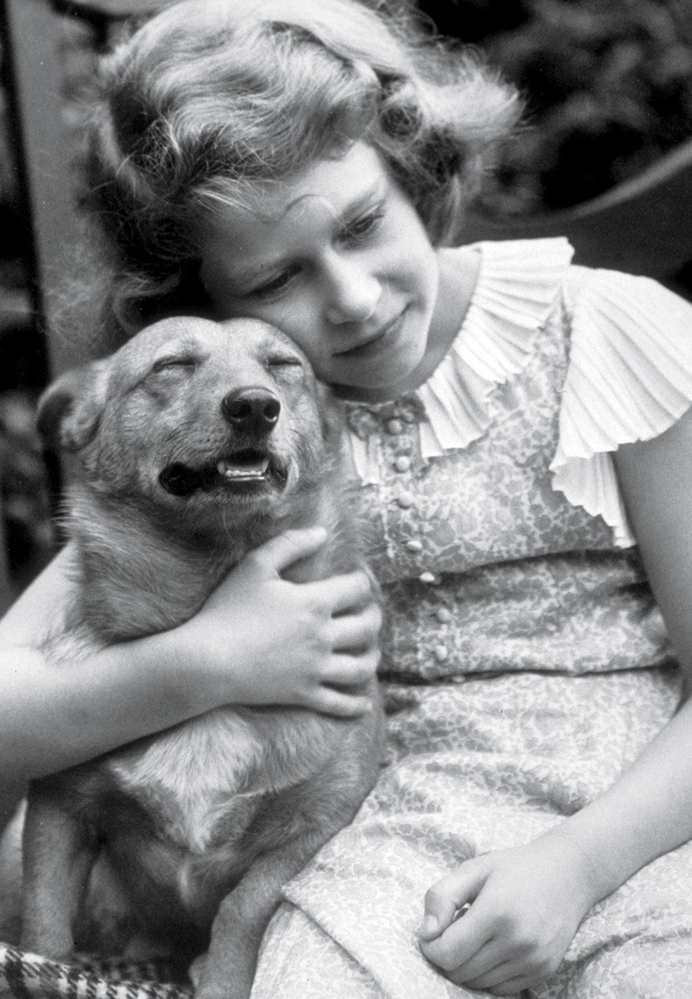 black and white photo of girl with dog