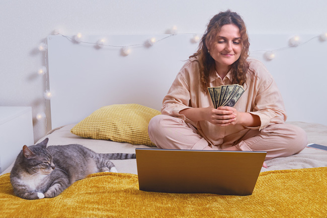 Woman budgeting with cat