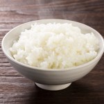 bowl of steamy rice on table